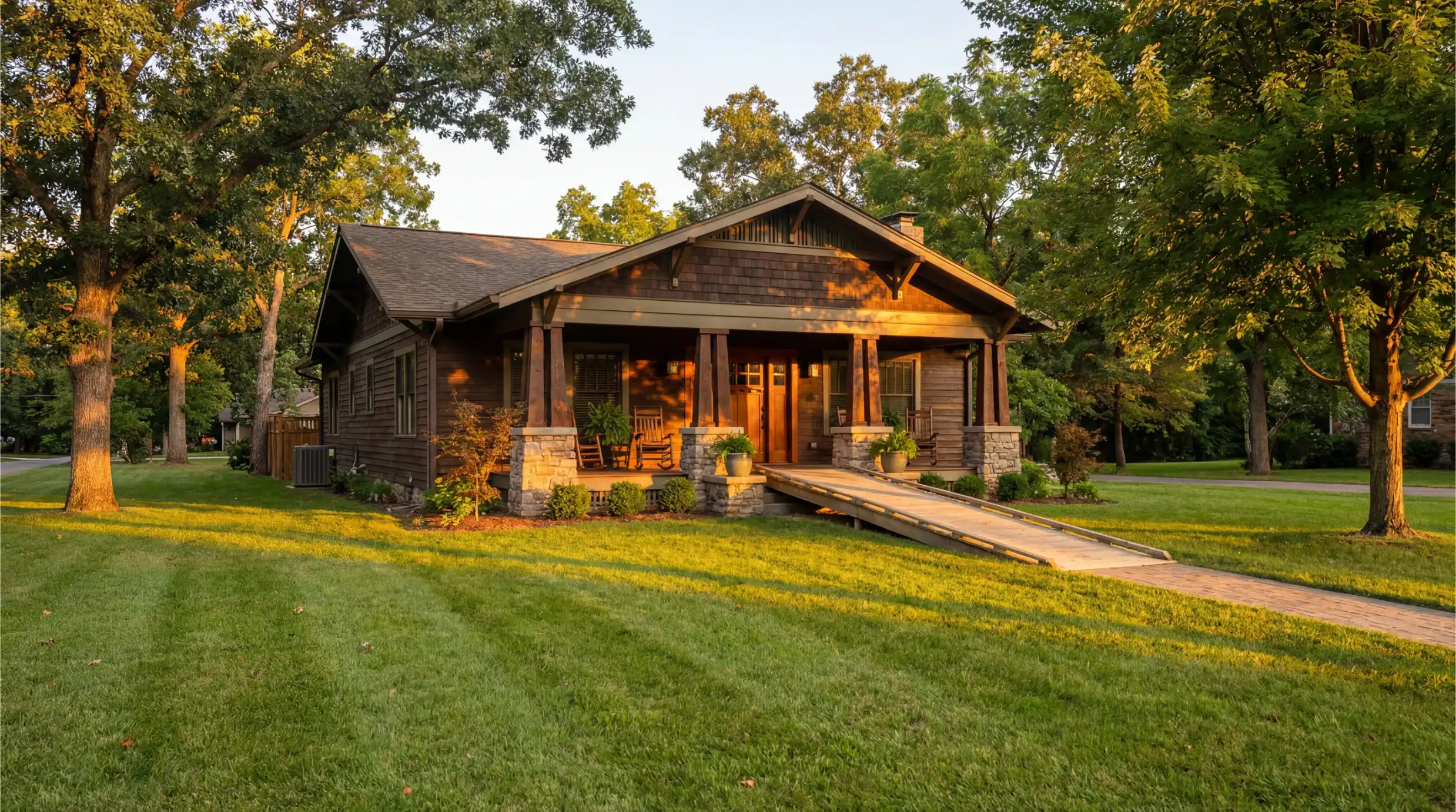 Wheelchair-accessible craftsman home with wooden ramp, wide porch, and mature trees — representing the kind of home our semi-truck accident client can now afford after $7 million settlement